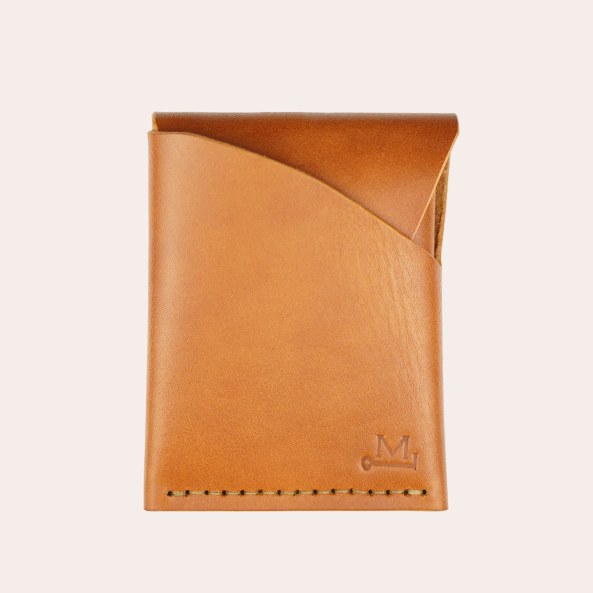 Beige leather wallet on a white background