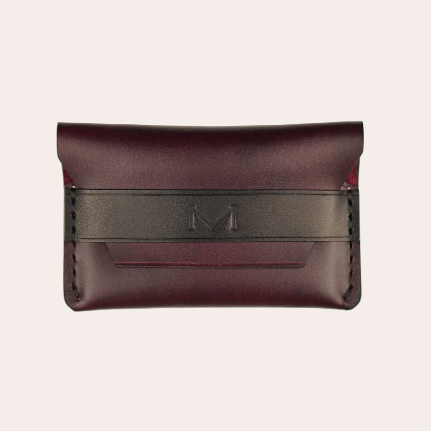 Brown leather wallet with a black strap on a white background
