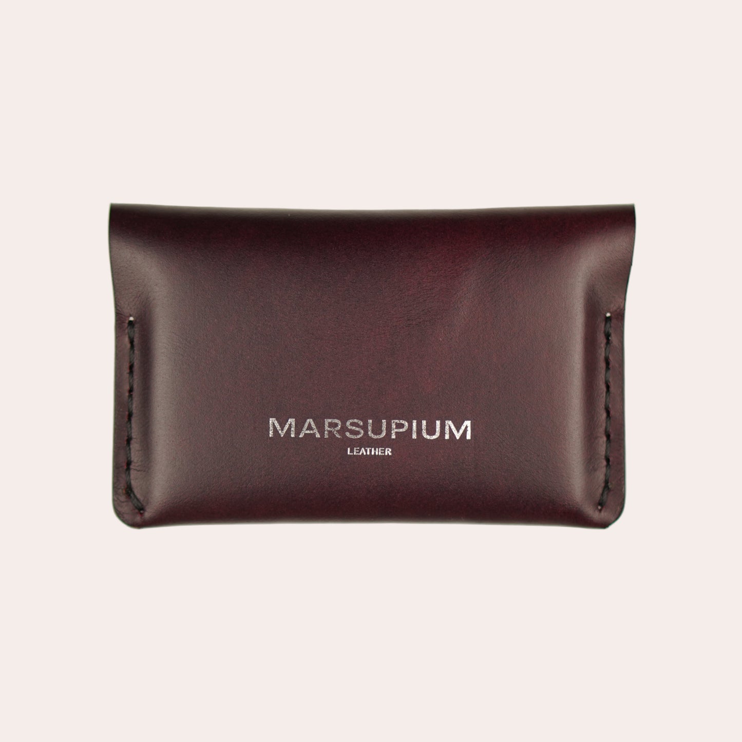 Brown leather wallet with 'Marsupium' branding on a white background