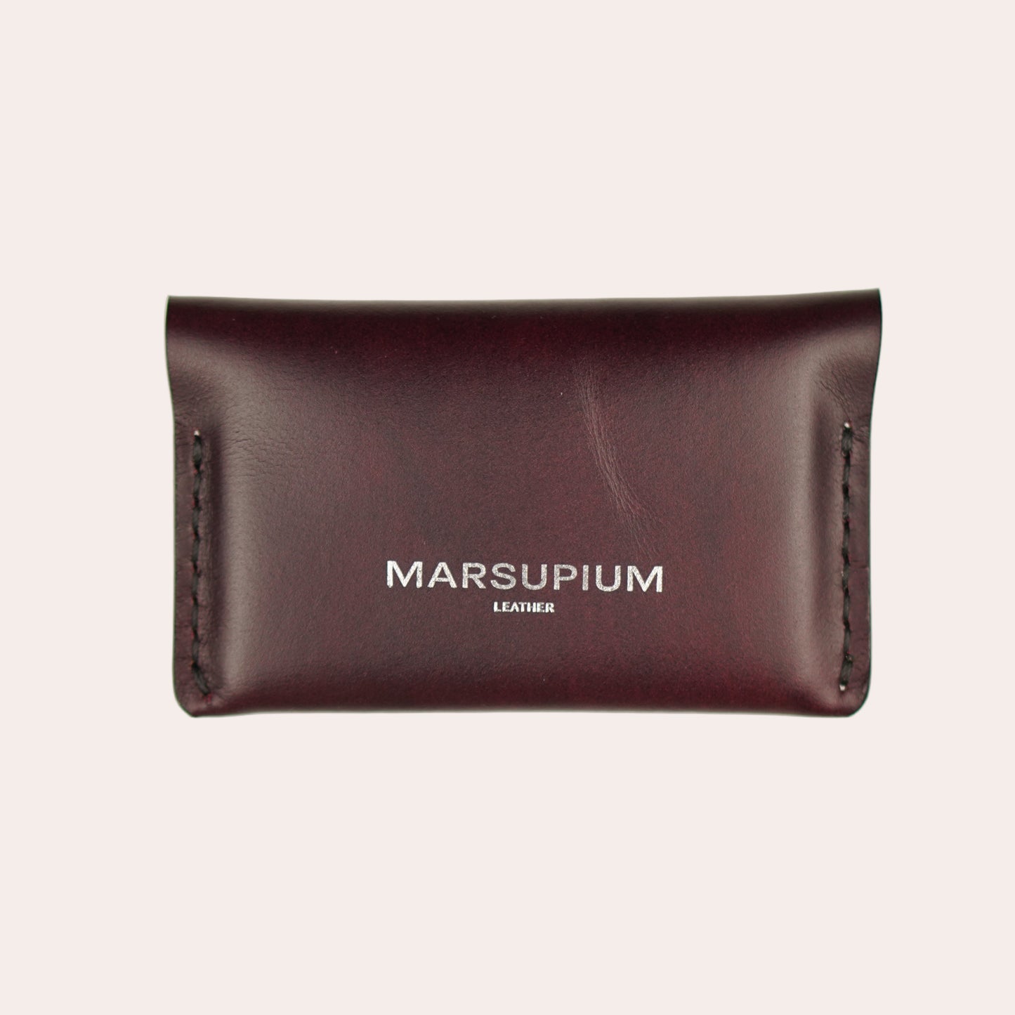 Brown leather wallet with 'Marsupium' branding on a white background