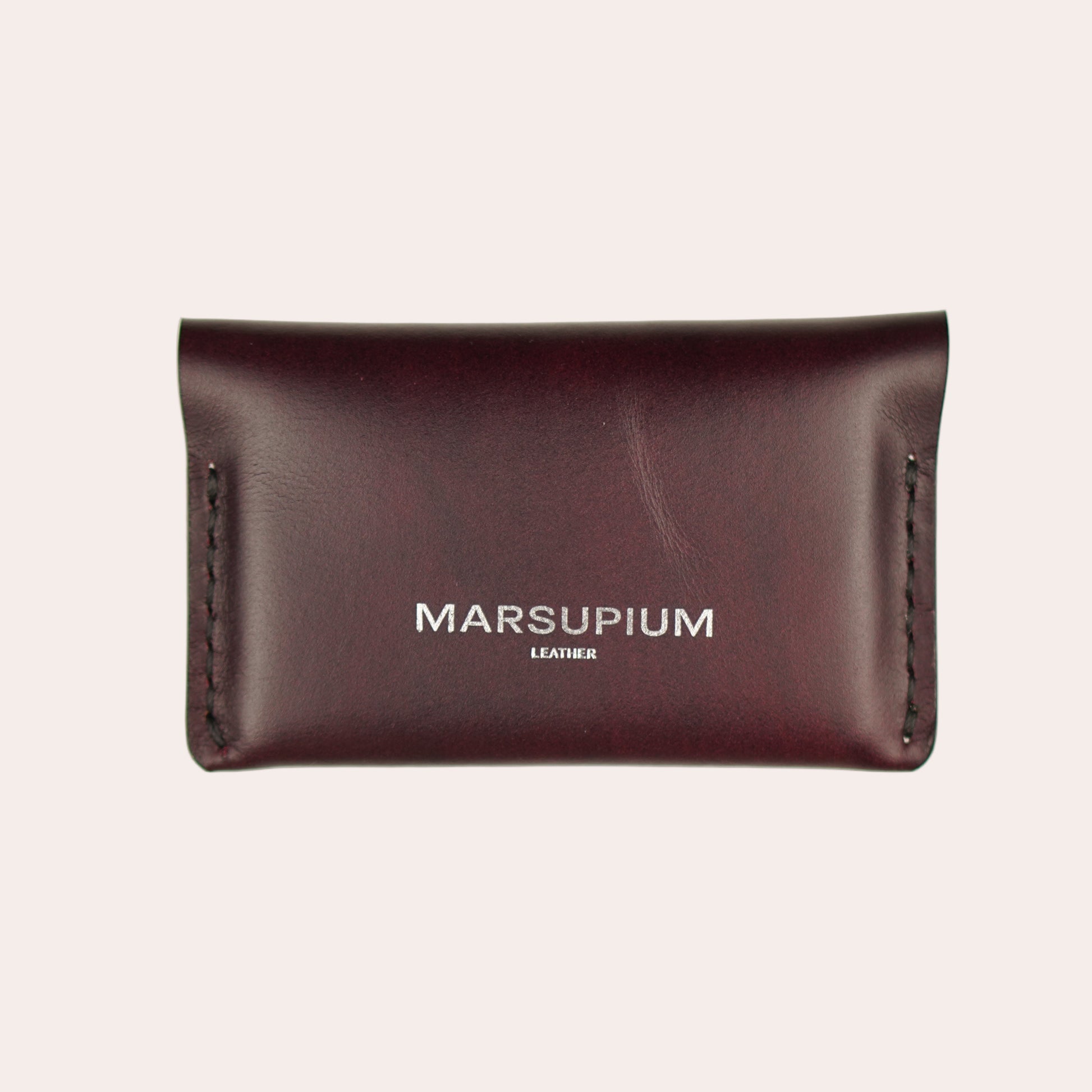 Brown leather wallet with 'Marsupium' branding on a white background