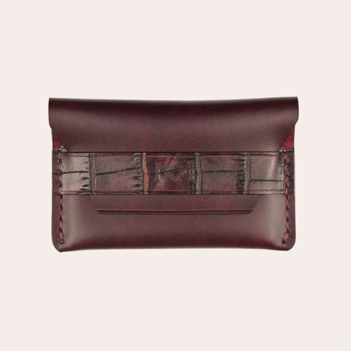 Brown leather clutch bag with a strap on a white background