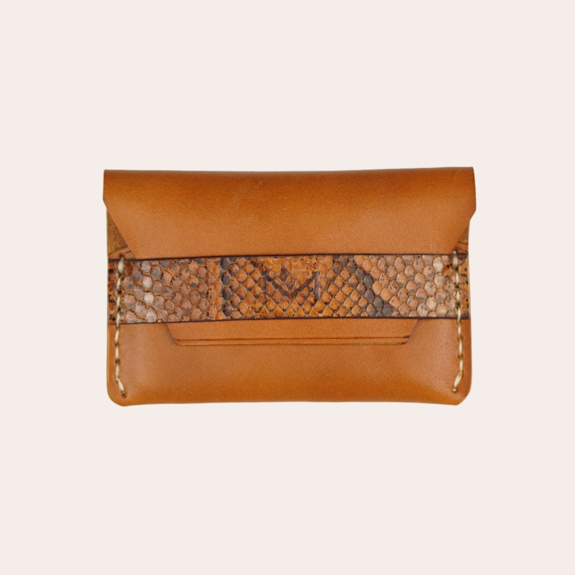 Brown leather clutch with snake skin pattern on a white background