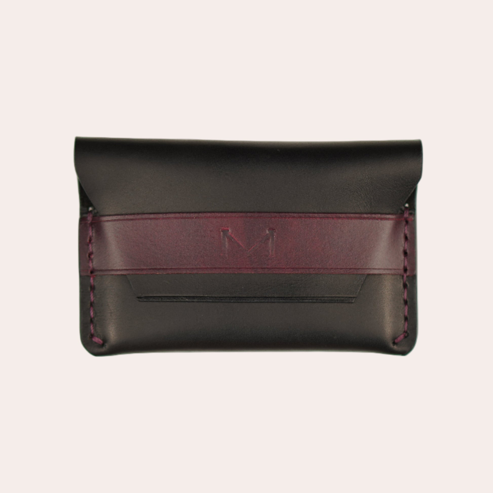 Black leather wallet with a burgundy strap on a white background