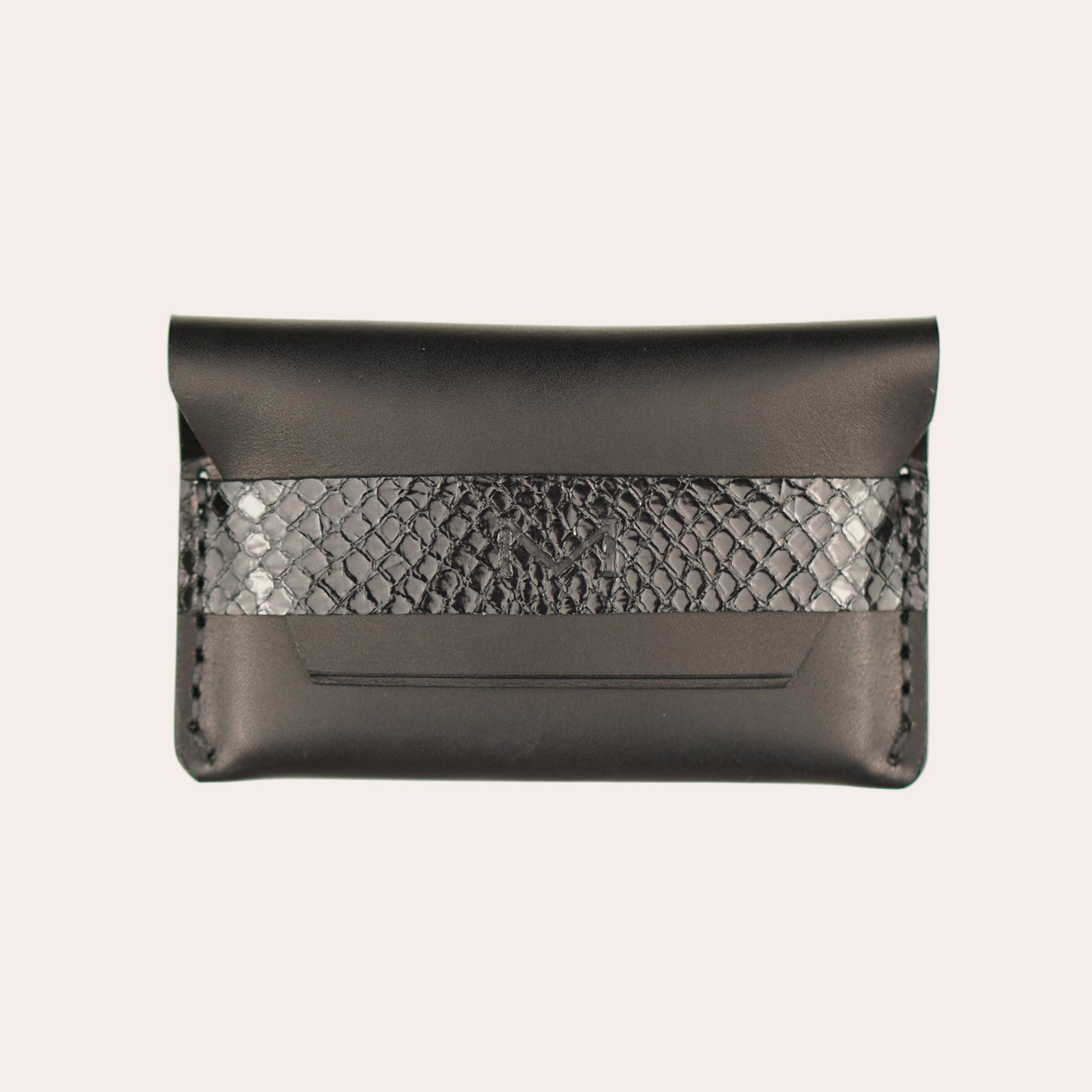 Black clutch bag with snake skin pattern on a white background