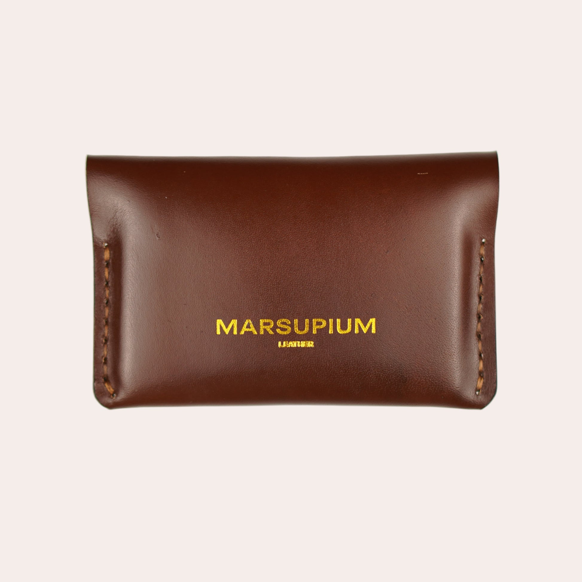 Brown leather pouch with 'MARSUPIUM' branding on a white background