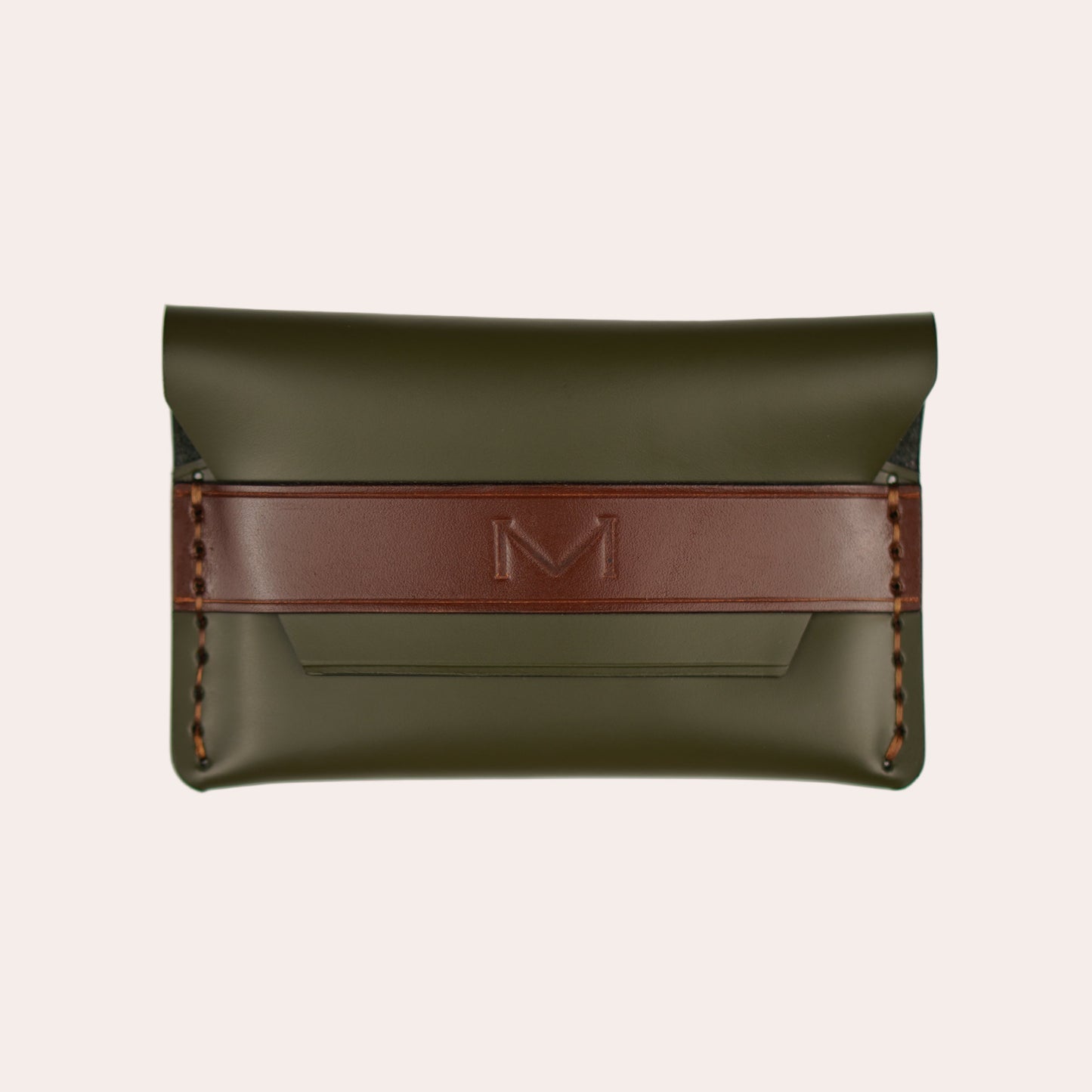 Green leather pouch with a red strap on a white background