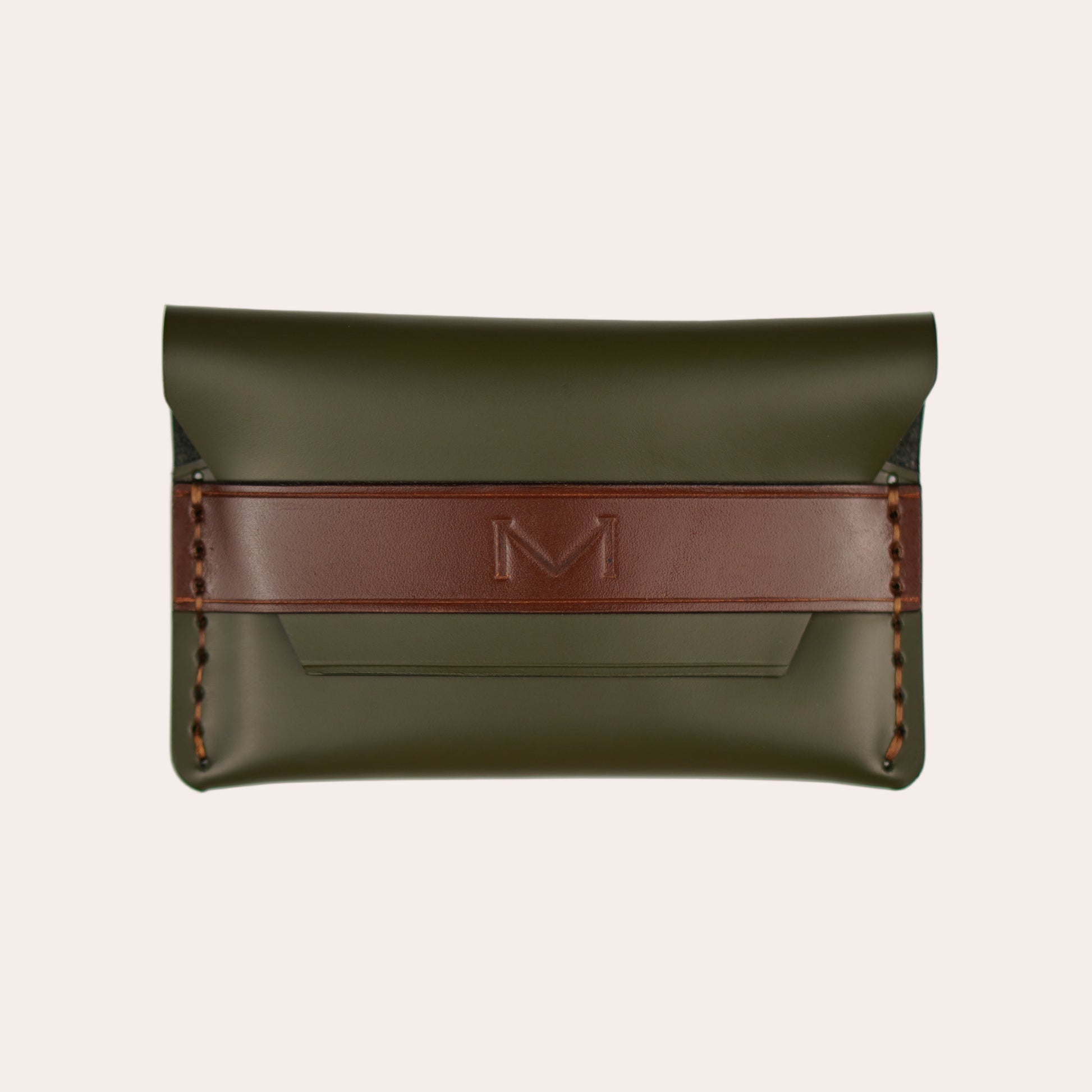 Green leather pouch with a red strap on a white background