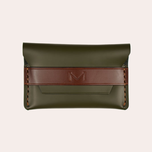 Green leather pouch with a red strap on a white background